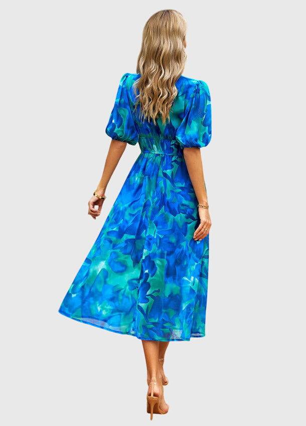 Emma & Rose Cape Town Merlin™ Flattering Floral Midi Dress, #1002 Estella with vibrant floral pattern and elegant silhouette.