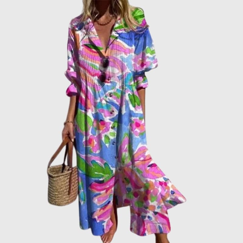 Zariah™ elegant bohemian dress by Emma & Rose Cape Town, featuring flowing fabric and intricate embroidery, worn by a model.