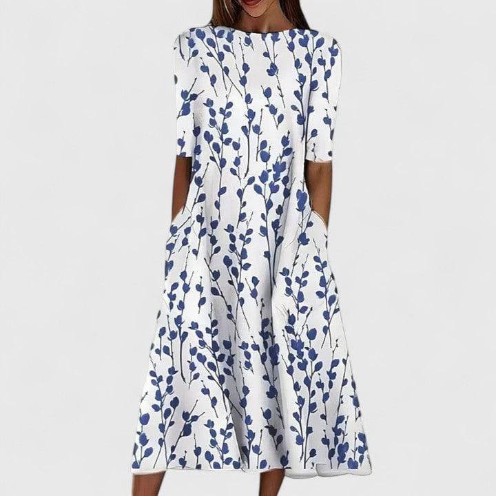 Sarah™ elegant midi dress by Emma & Rose Cape Town, featuring a flowing fabric and stylish design, shown on a model.