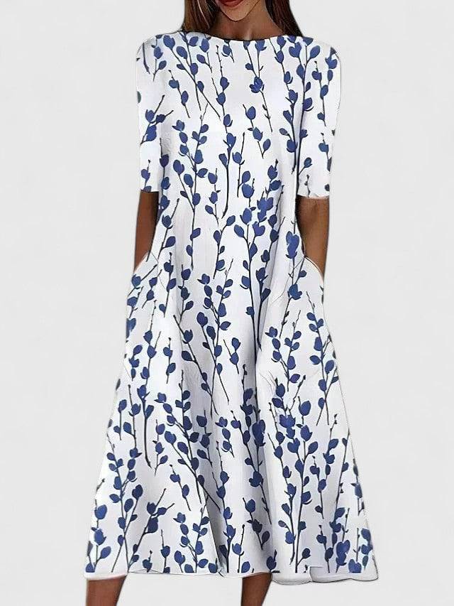Karelieth™ midi dress by Emma & Rose Cape Town featuring elegant design and sophisticated style, full-length view in natural light.
