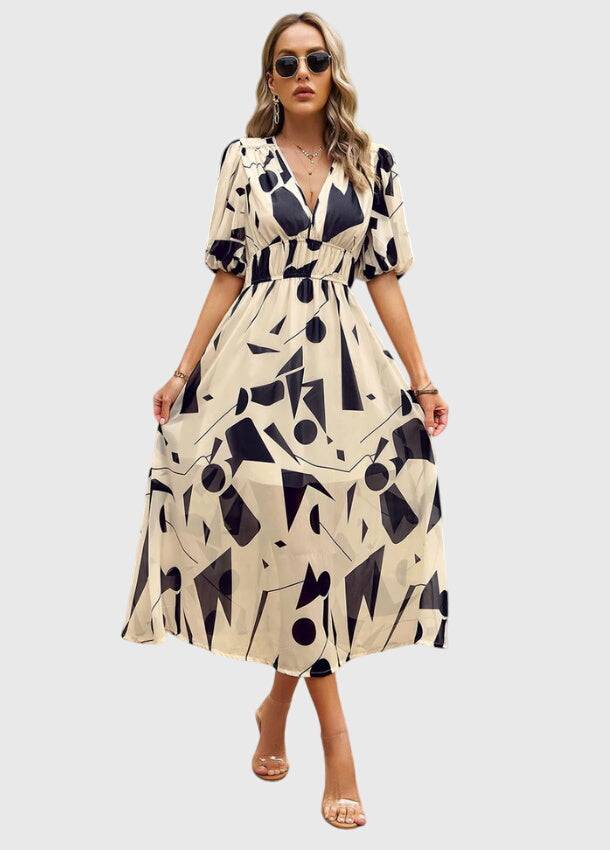 Flattering floral midi dress by Emma & Rose Cape Town, style #1002 Estella, featuring vibrant floral print and elegant silhouette.