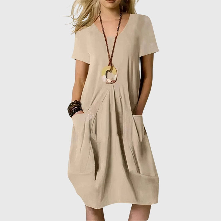 Naomi™ casual dress by Emma & Rose Cape Town, stylish and comfortable, featuring a relaxed fit and soft fabric in natural tones.