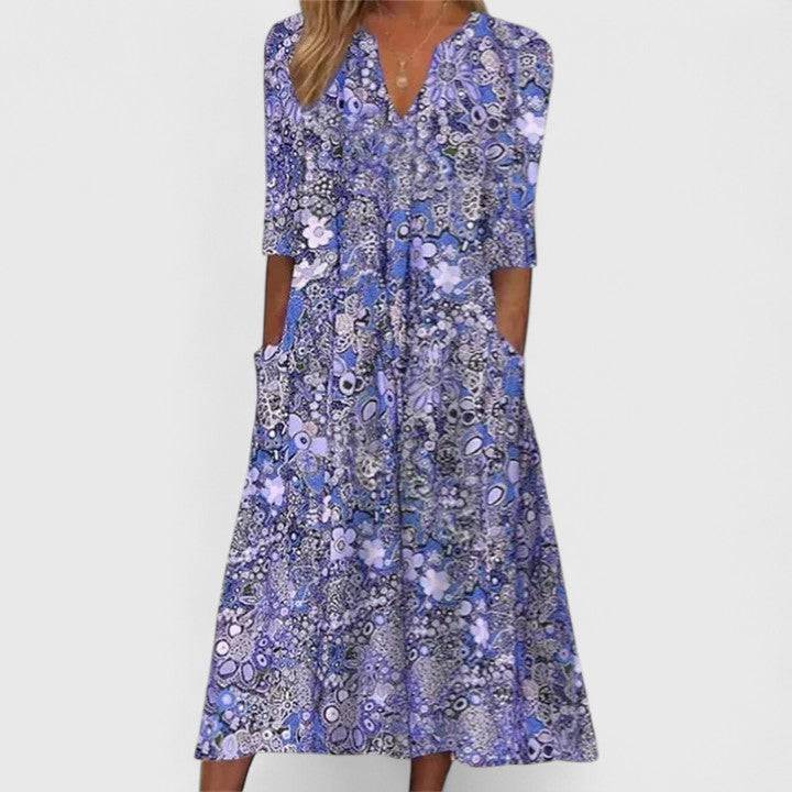 Emma & Rose Cape Town Queenie™ elegant summer dress featuring lightweight fabric, floral pattern, and flowy design.