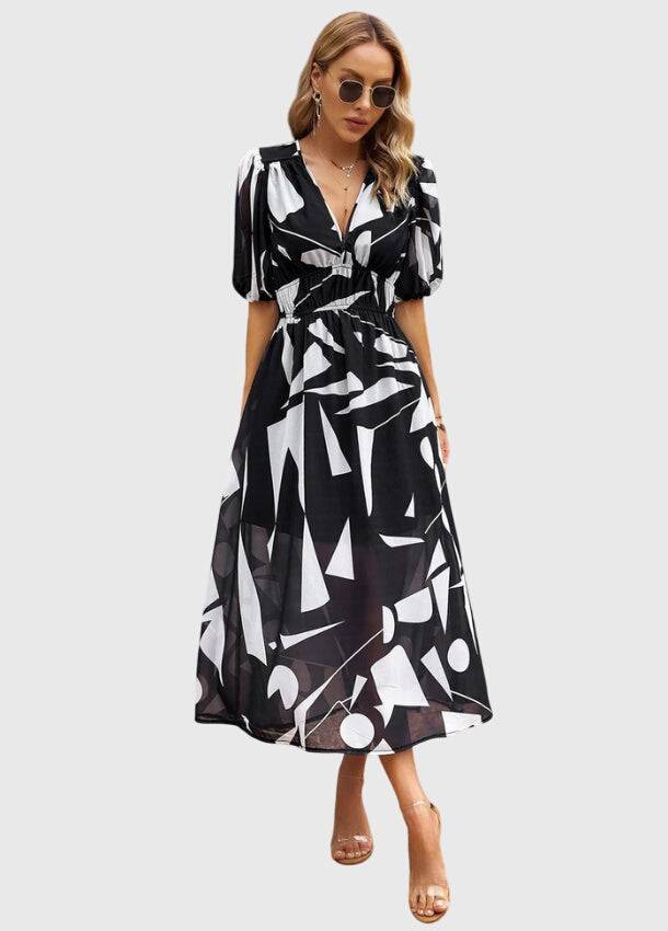 Emma & Rose Cape Town Merlin™ Estella floral midi dress with flattering fit and vibrant floral pattern on lightweight fabric.