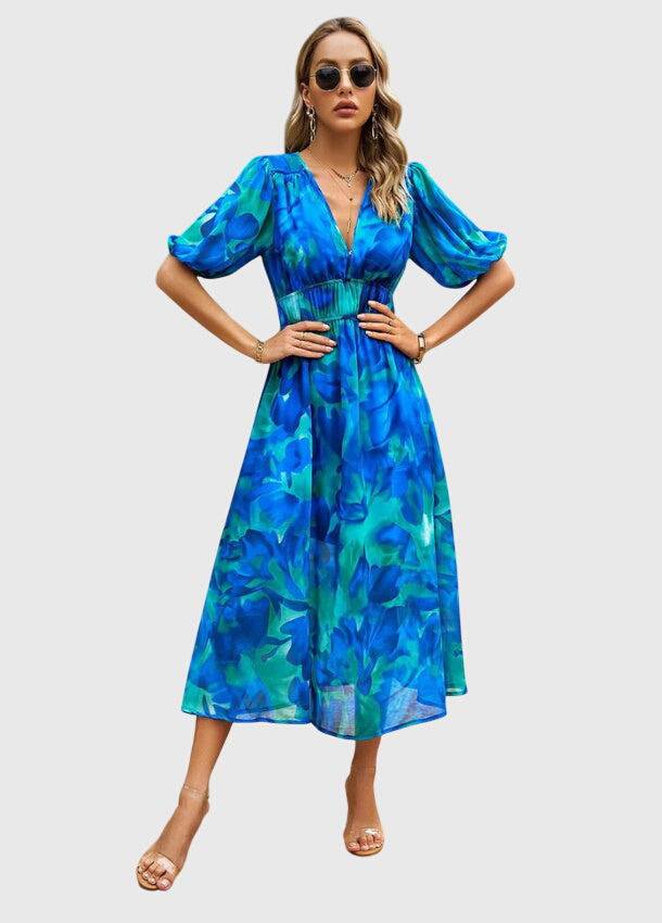 Emma & Rose Cape Town Merlin™ Estella floral midi dress with a flattering silhouette and vibrant floral pattern.