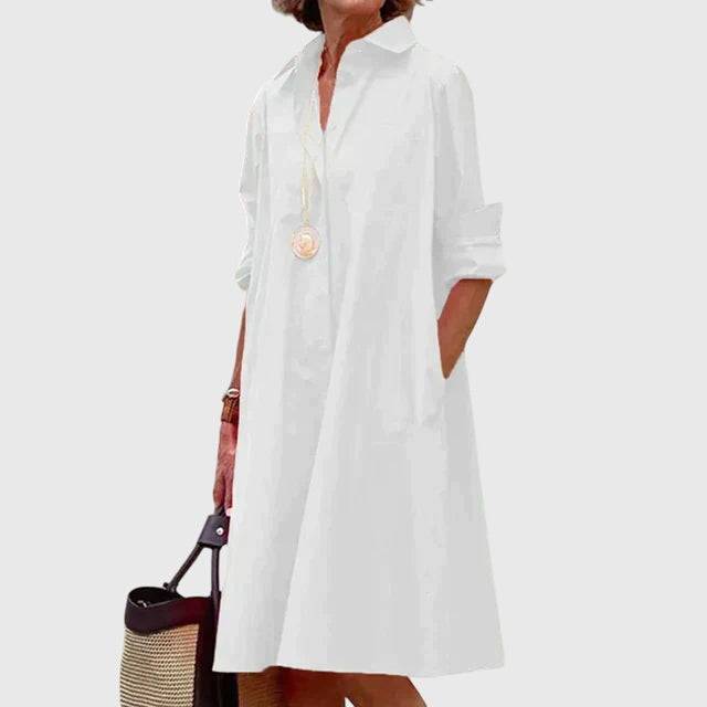 Emma & Rose Cape Town Paige elegant dress with stylish pockets, showcasing the dress's fabric and pocket details.