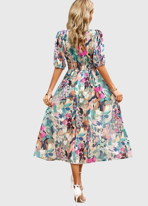Emma & Rose Cape Town Merlin™ Flattering Floral Midi Dress #1002 Estella with vibrant floral pattern and elegant midi length.