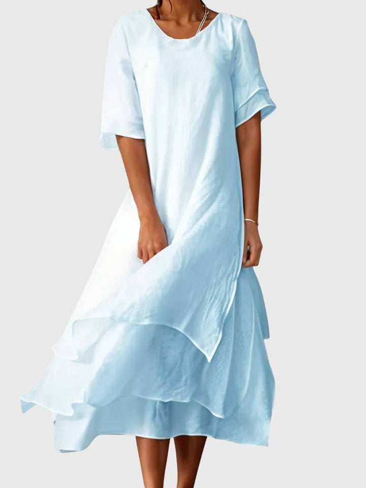 Elegant April™ dress by Emma & Rose Cape Town, featuring a stylish fit and detailed design, shown on a model.