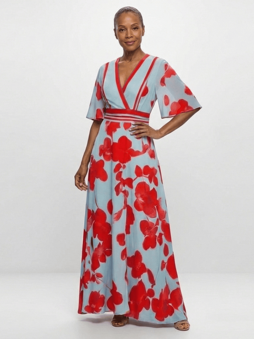 Corinne™ floral maxi dress by Emma & Rose Cape Town, featuring long sleeves and vibrant floral pattern, displayed on a hanger.