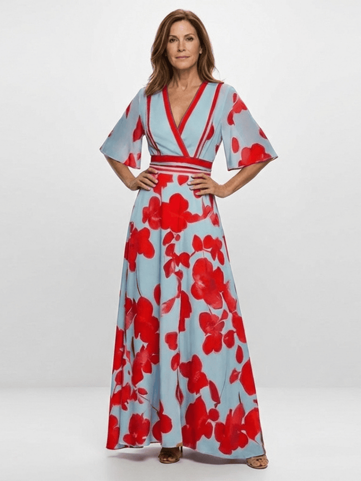 Corinne™ floral maxi dress by Emma & Rose Cape Town, featuring long sleeves and a flowing, vibrant floral pattern.