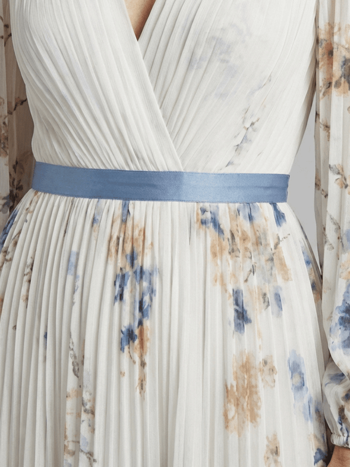 Lavinia™ floral maxi dress by Emma & Rose Cape Town featuring a flowing neck design and vibrant floral pattern.