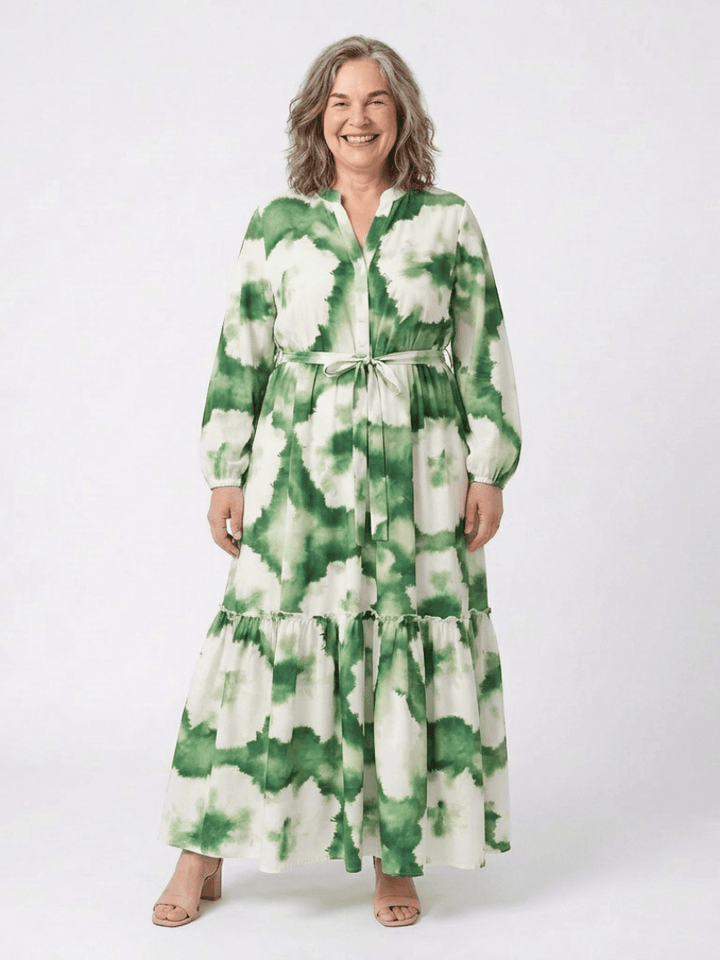Sabine™ waist tiered maxi dress by Emma & Rose Cape Town, featuring flowing fabric and a fitted waist silhouette.
