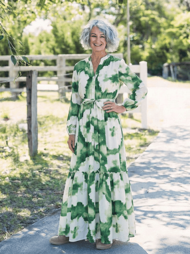 Sabine™ waist tiered maxi dress by Emma & Rose Cape Town, featuring flowing fabric and a tiered design in a full-length style.