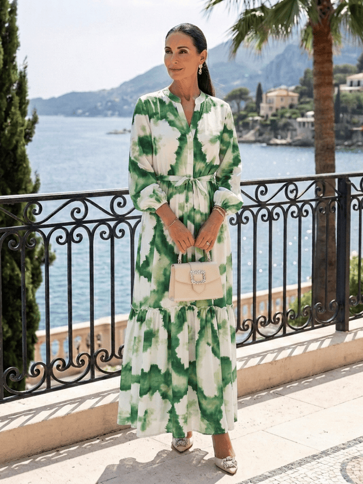 Sabine™ waist tiered maxi dress by Emma & Rose Cape Town, featuring flowing fabric and a stylish tiered design.