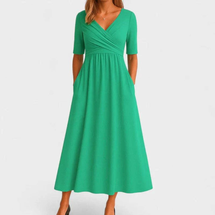 Elegant Phoebe™ midi dress by Emma & Rose Cape Town, featuring a flowing fabric and stylish design, shown on a model.