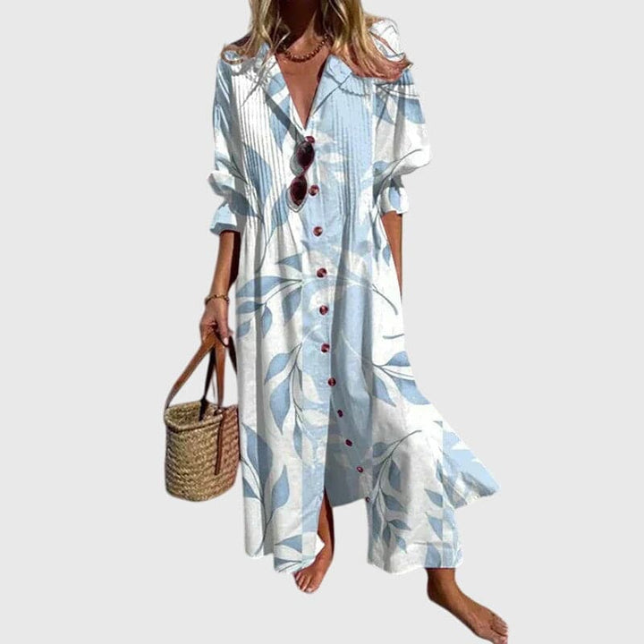 Zariah™ elegant bohemian dress by Emma & Rose Cape Town, flowing fabric with intricate patterns and relaxed fit.