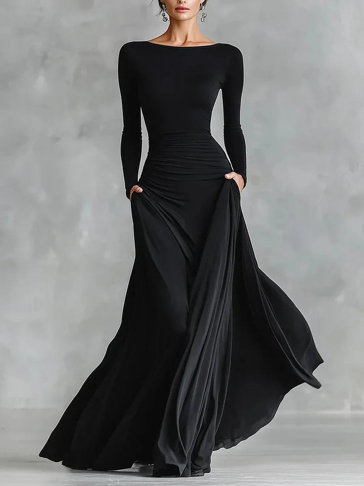 Modern long black crepe dress with pleated boat neckline