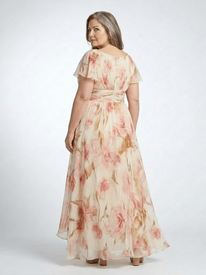 Elara™ floral maxi dress by Emma & Rose Cape Town featuring long sleeves, vibrant floral pattern, and flowing fabric.
