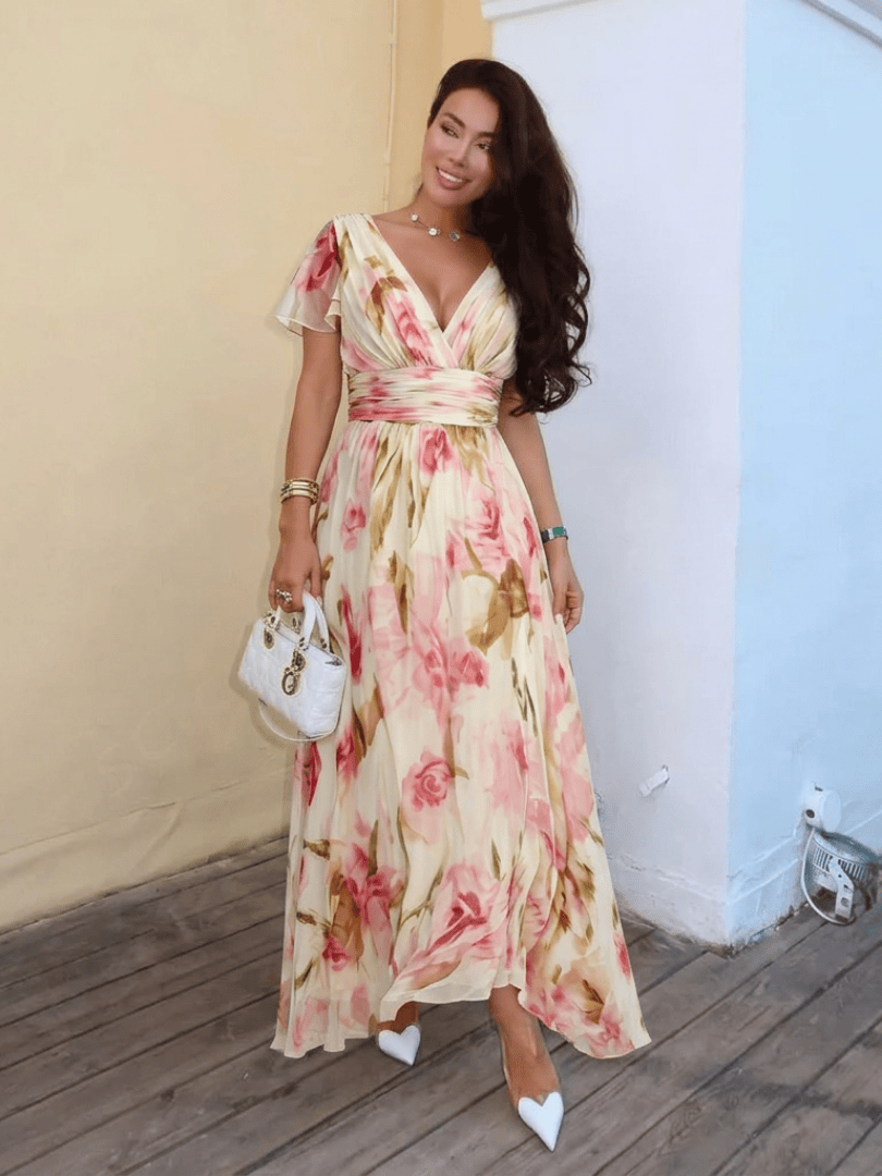 Emma & Rose Cape Town Elara™ Sleeve Floral Maxi Dress featuring a flowy silhouette and vibrant floral pattern