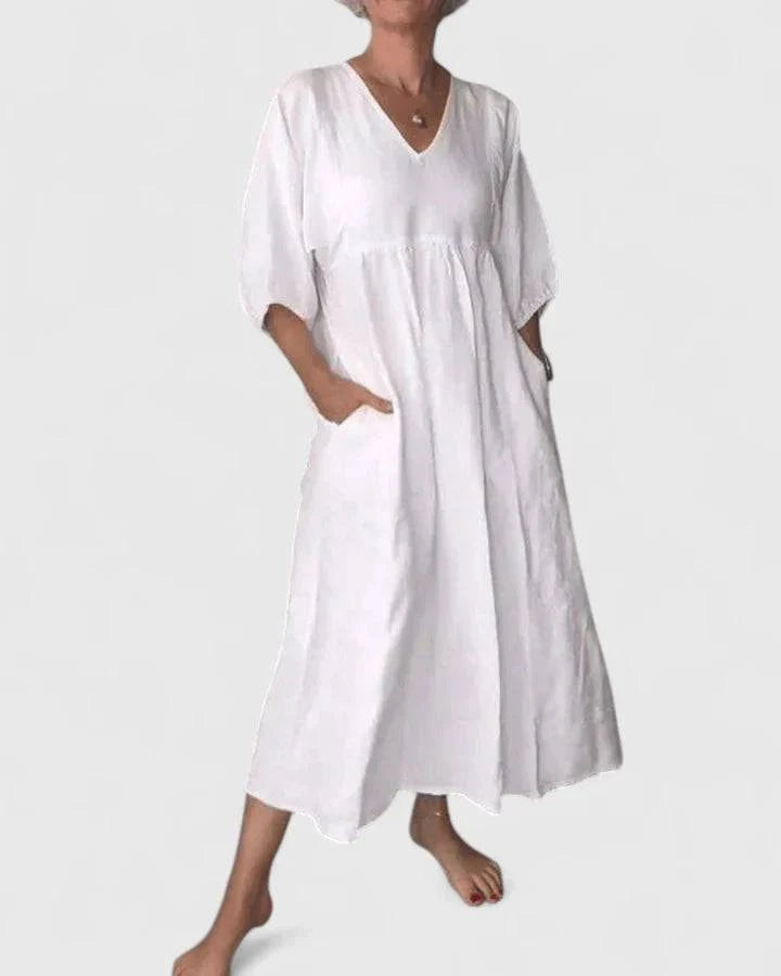 Elegant Thalyssa™ maxi dress by Emma & Rose Cape Town featuring a V-neckline and flowing linen fabric.