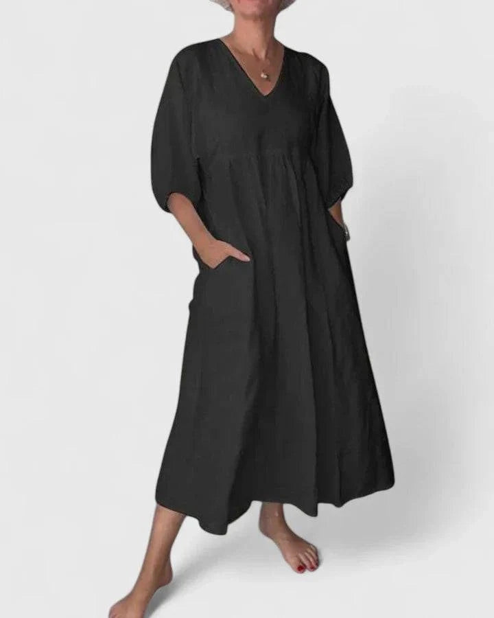 Elegant Thalyssa™ maxi dress by Emma & Rose Cape Town, featuring a V-neckline and lightweight linen fabric.
