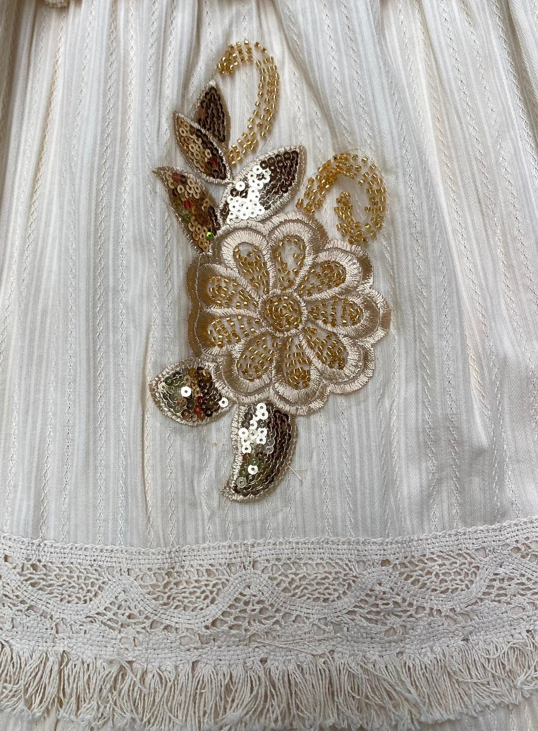 Emma & Rose Cape Town Fleur Dafne Dress, elegant flowy abiti with floral details, showcased on a hanger.