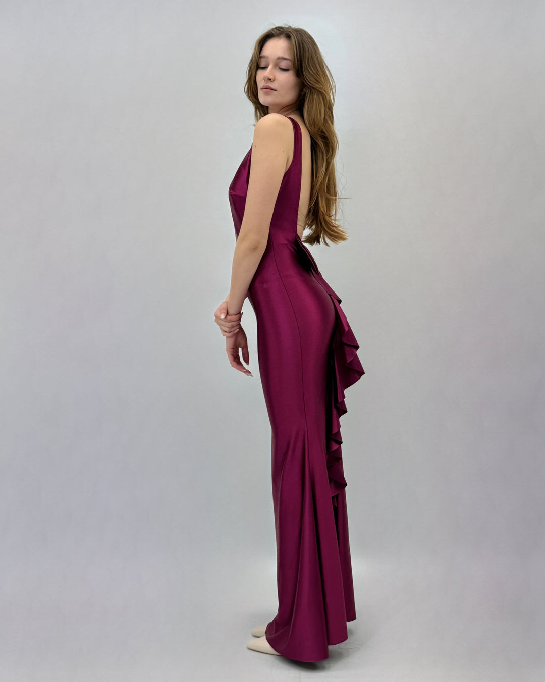 Emma & Rose Cape Town Ingrid™ green dress with boat neckline and soft luxurious fabrics, perfect for elegant occasions.