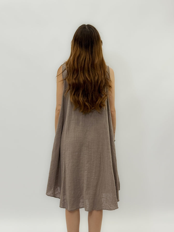 Emma & Rose Cape Town Zara Light Wide Dress, white abiti with flowing fabric and wide silhouette, displayed on a hanger.