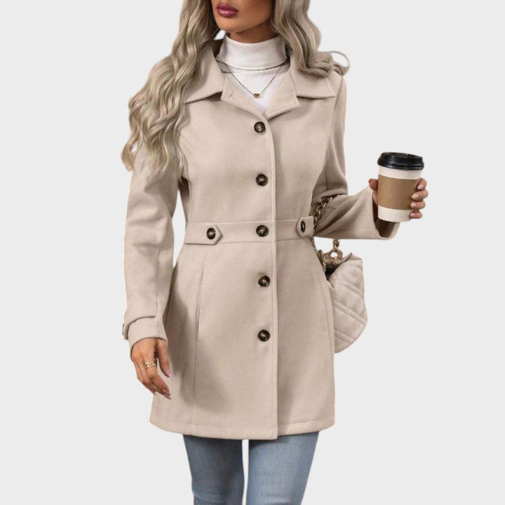 Emma & Rose Cape Town Channel™ elegant coat, stylish abrigo with tailored fit and classic design, displayed on a hanger.