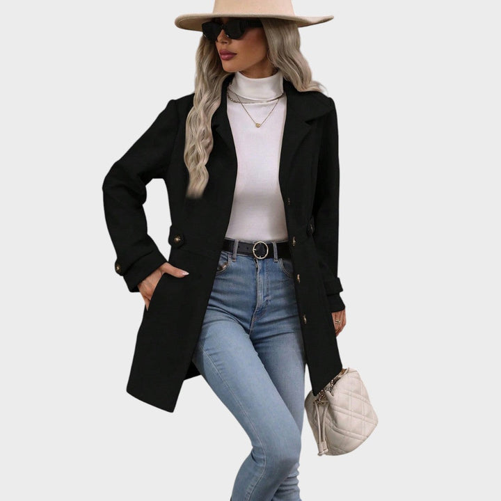 Emma & Rose Cape Town Channel™ elegant coat, stylish abrigo with tailored fit and classic design, displayed on a hanger.