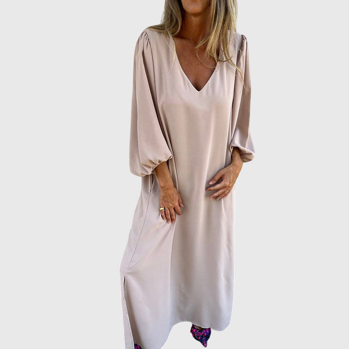 Emma & Rose Cape Town Carol long boho dress in apricot with pockets, featuring a relaxed fit and flowing fabric.