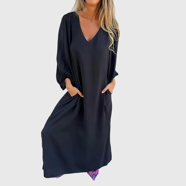 Emma & Rose Cape Town Carol long boho dress with pockets in apricot, featuring flowing fabric and casual bohemian style.