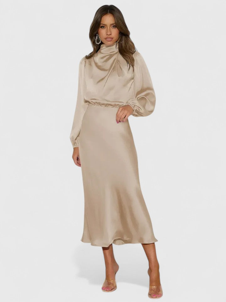 Beige Emryssah™ elegant maxi dress from Emma & Rose Cape Town featuring a flowing design and stylish silhouette.
