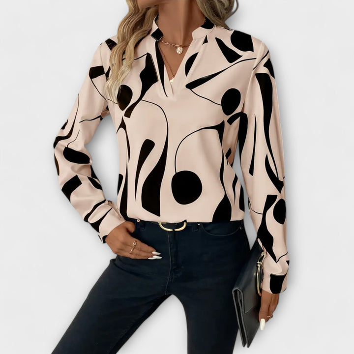 Beige Lara™ elegant blouse from Emma & Rose Cape Town, featuring a stylish, flowing design and sophisticated details.