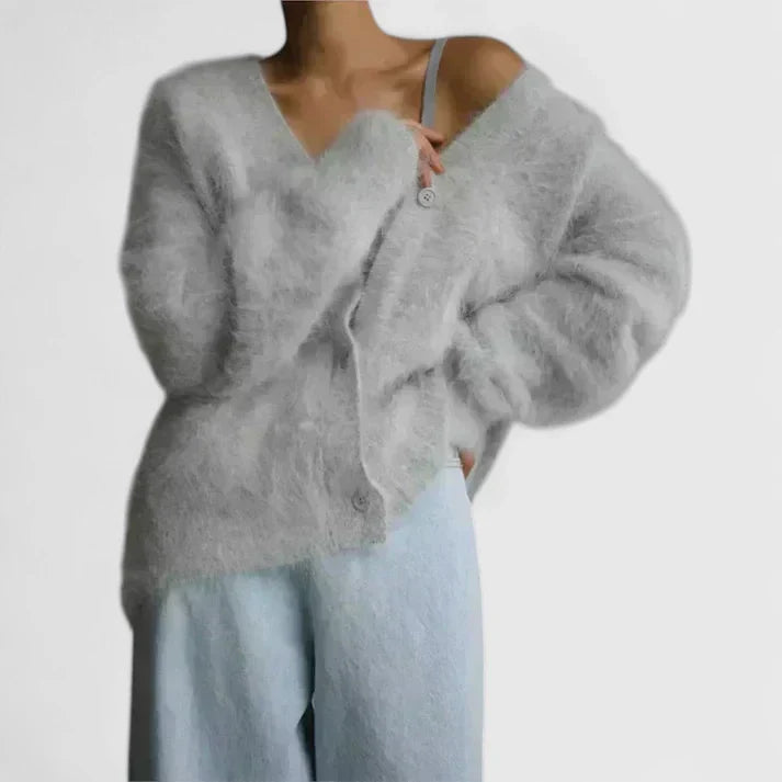 Beige Lucerinna™ comfortable cardigan by Emma & Rose Cape Town, shown on a model, featuring soft knit fabric and relaxed fit.