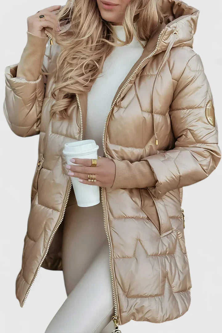 Beige Lyzzandra™ comfortable coat by Emma & Rose Cape Town, shown hanging, highlighting its cozy fabric and stylish design.