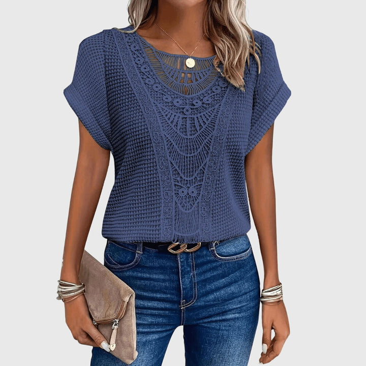 Beige Pearl™ Ibiza Blouse by Emma & Rose Cape Town featuring lightweight fabric and elegant design, displayed on a hanger.