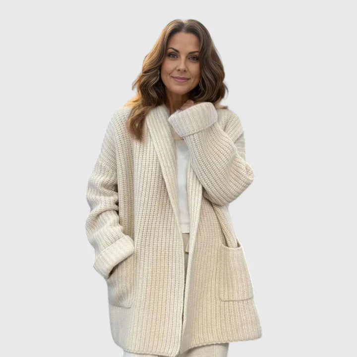 Beige Emma & Rose Cape Town Saryphina comfortable cardigan, soft knit fabric, shown on a hanger.
