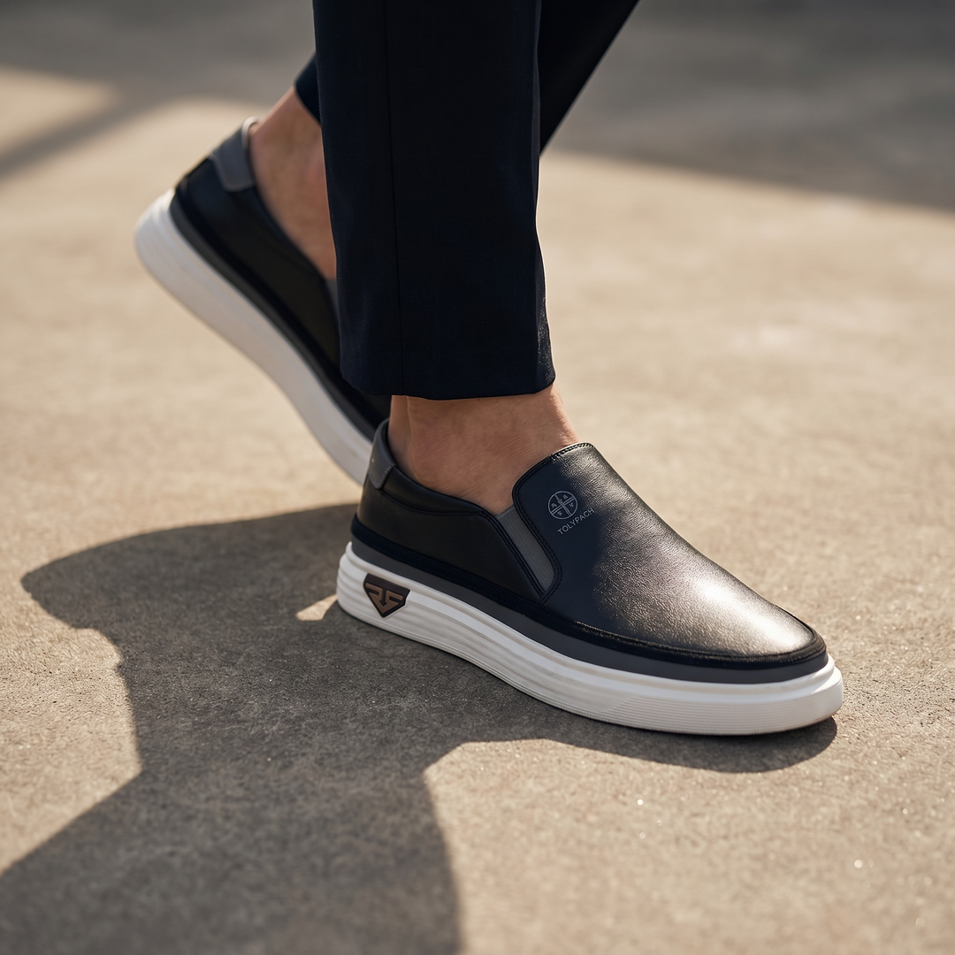 Black Torino™ slip-on PU leather sneakers by Emma & Rose Cape Town, featuring a sleek design and comfortable fit.