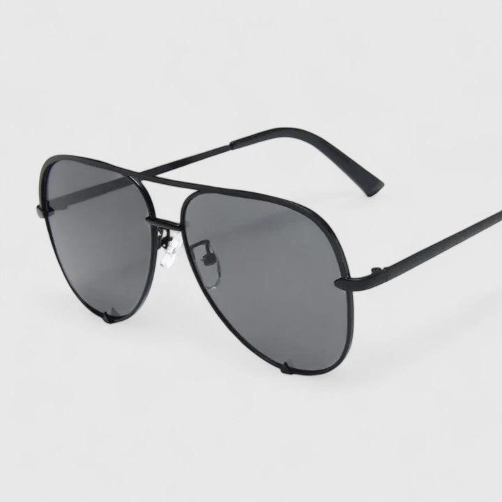 Tynzlee™ elegant sunglasses by Emma & Rose Cape Town featuring black and blue frames with tinted lenses.