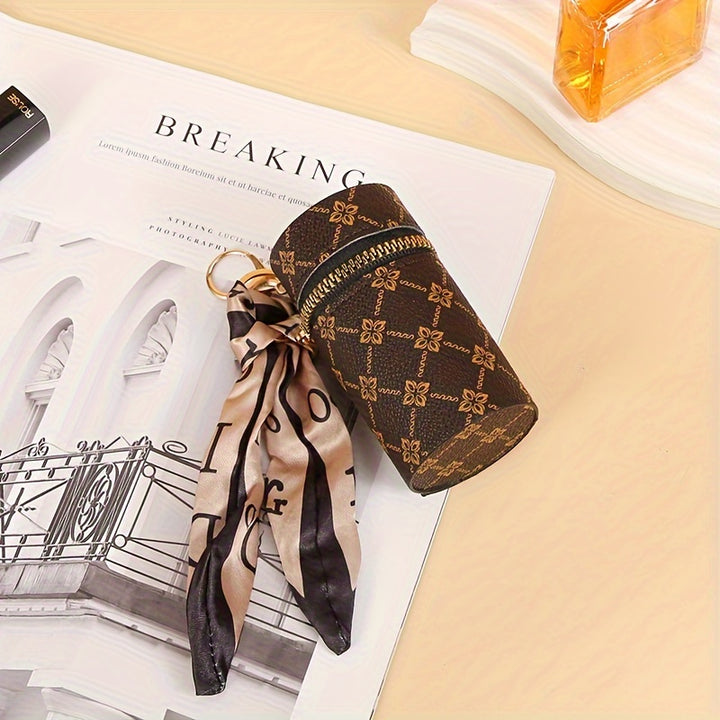 Black Emma & Rose Cape Town Bucky lipstick, earphone, and mini bag set with sleek design and compact size.