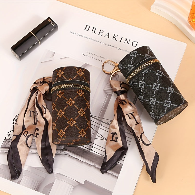 Black Emma & Rose Cape Town Bucky mini bag with lipstick and earphone accessories, stylish and compact for everyday use.