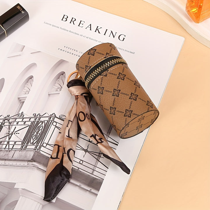Black Bucky lipstick, earphone, and mini bag by Emma & Rose Cape Town displayed together in a stylish arrangement.