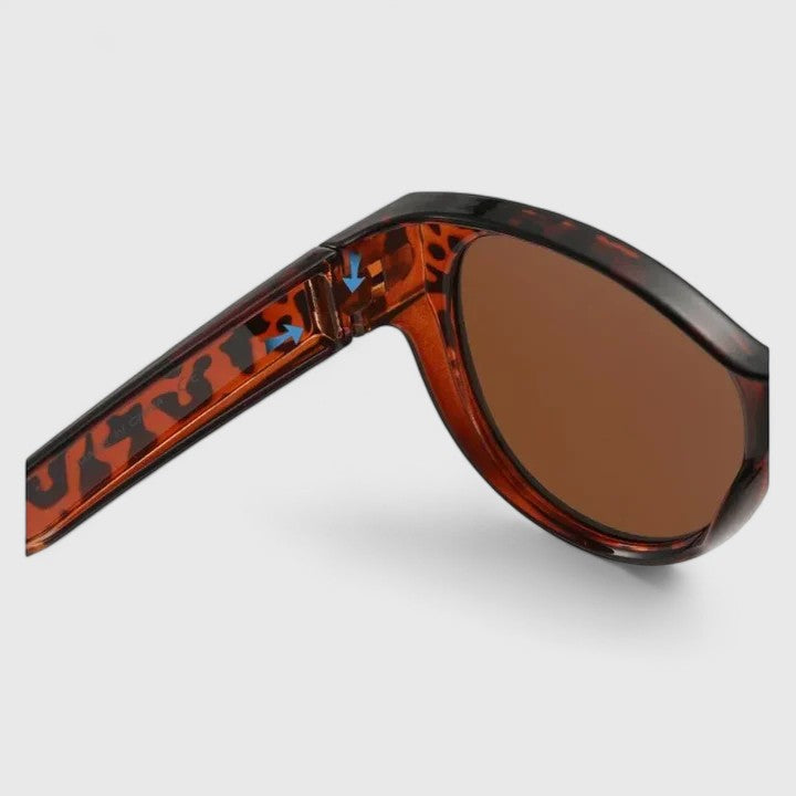 Emma & Rose Cape Town Journii stylish black sunglasses with sleek frames and tinted lenses.
