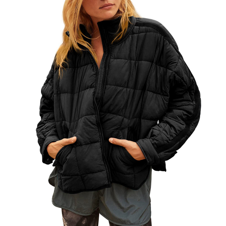 Black April™ Compact Zip Puffer Jacket by Emma & Rose Cape Town, shown in a close-up of the fitted, insulated winter jacket.