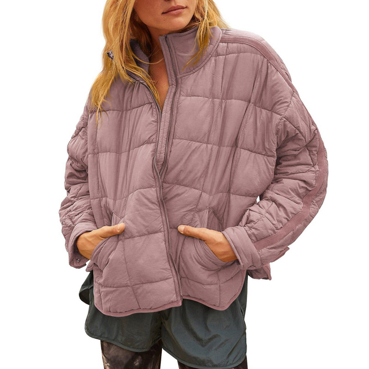 Black April™ Compact Zip Puffer Jacket by Emma & Rose Cape Town, featuring a sleek, insulated design with a front zipper.