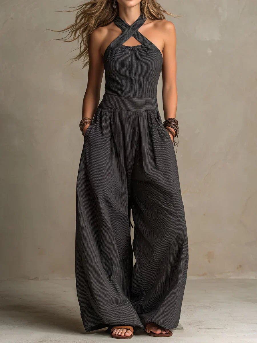 Black Ariana jumpsuit by Emma & Rose Cape Town featuring an elegant crossed neckline and tailored fit.