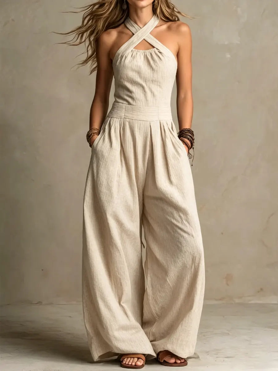 Black Ariana elegant jumpsuit by Emma & Rose Cape Town featuring a crossed neckline and fitted silhouette.