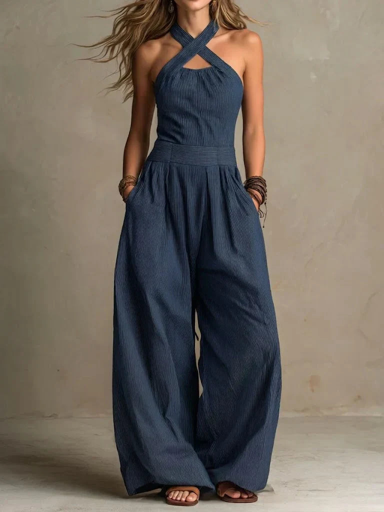 Black Ariana jumpsuit by Emma & Rose Cape Town featuring an elegant crossed neckline and tailored fit.