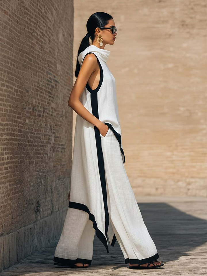 Elegant black two-piece set from Elke™ by Emma & Rose Cape Town, featuring a stylish cut design on the top and matching skirt.
